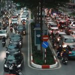 Busy motorbike traffic on Hanoi Old Quarter streets at rush hour