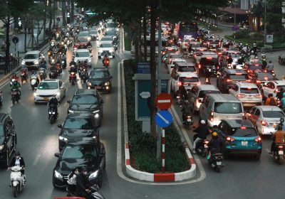 Busy motorbike traffic on Hanoi Old Quarter streets at rush hour