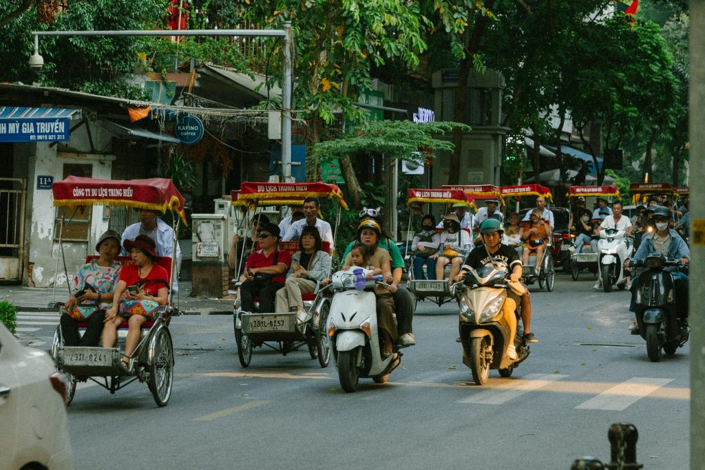 Traditional cyclo rickshaw ride through Hanoi Old Quarter near Hoan Kiem Lake