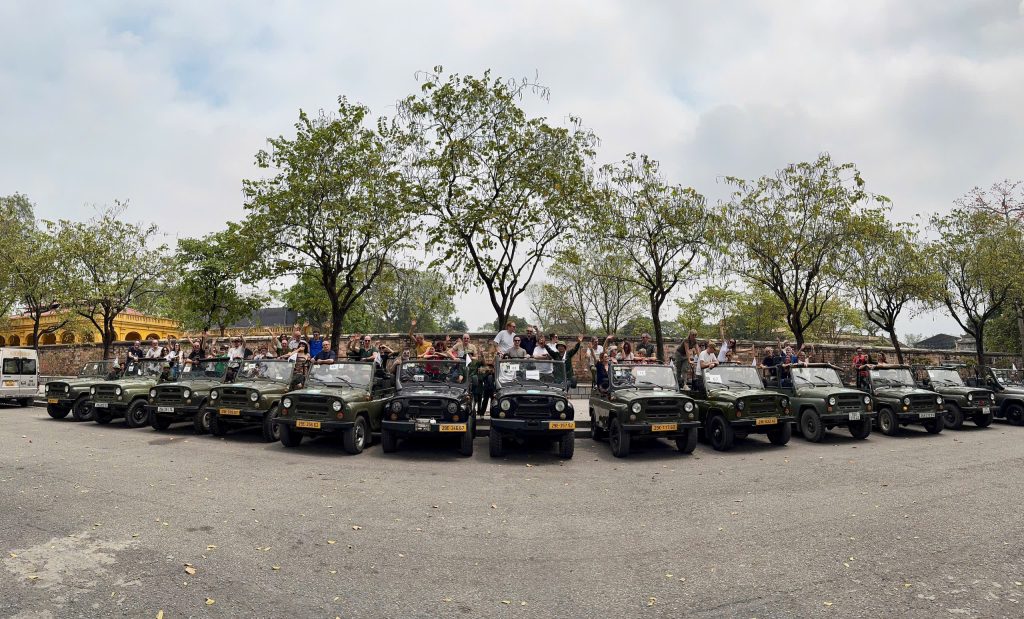 Large group enjoying a Hanoi Vintage Army Jeep Tour.